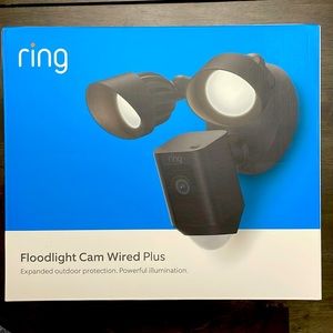 Ring Floodlight Cam Wired Plus and yard security sign